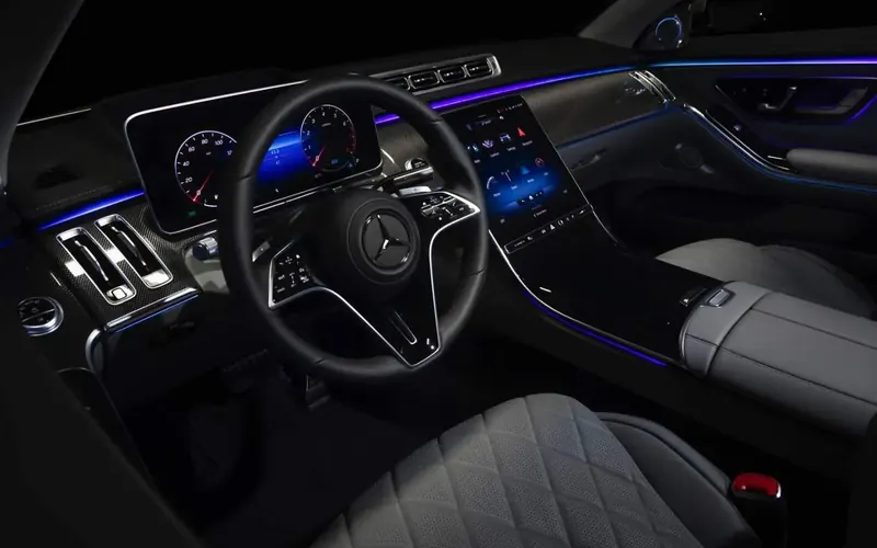 Luxury sedan interior with leather seats and ambient lighting