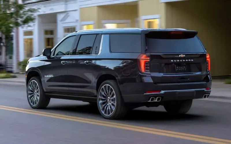 Black full-size SUV outside a building