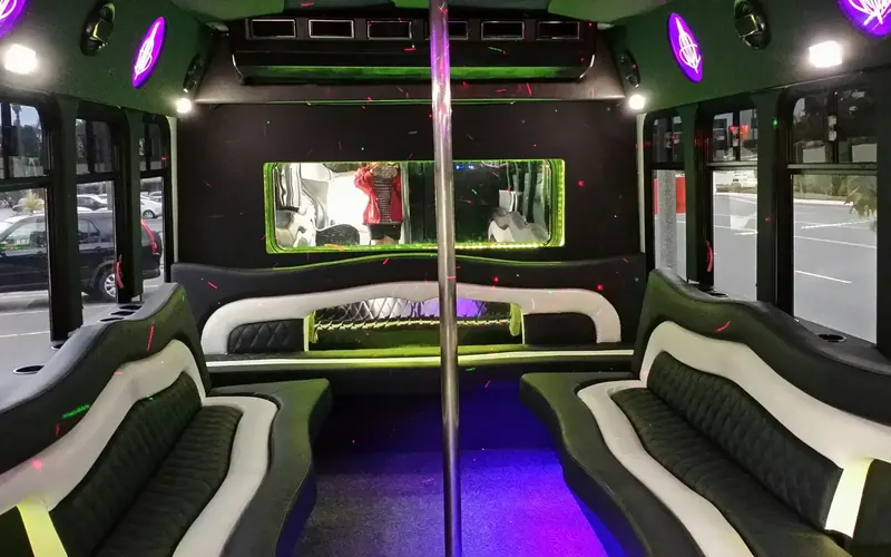 Party bus cabin with lighting and wraparound seating
