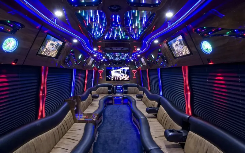 Party bus interior with LED ceiling and leather seating